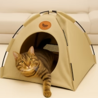 Brown tabby cat relaxing inside a beige portable cooling pet tent in a modern indoor setting