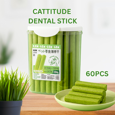 Cattitude Dental Stick packaging with green sticks on a wooden surface