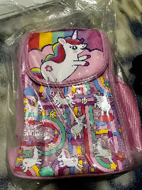 Kids pink unicorn lunch bag in clear packaging on soft background